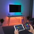 Smart LED Strip Lights glowing RGB colors behind a TV